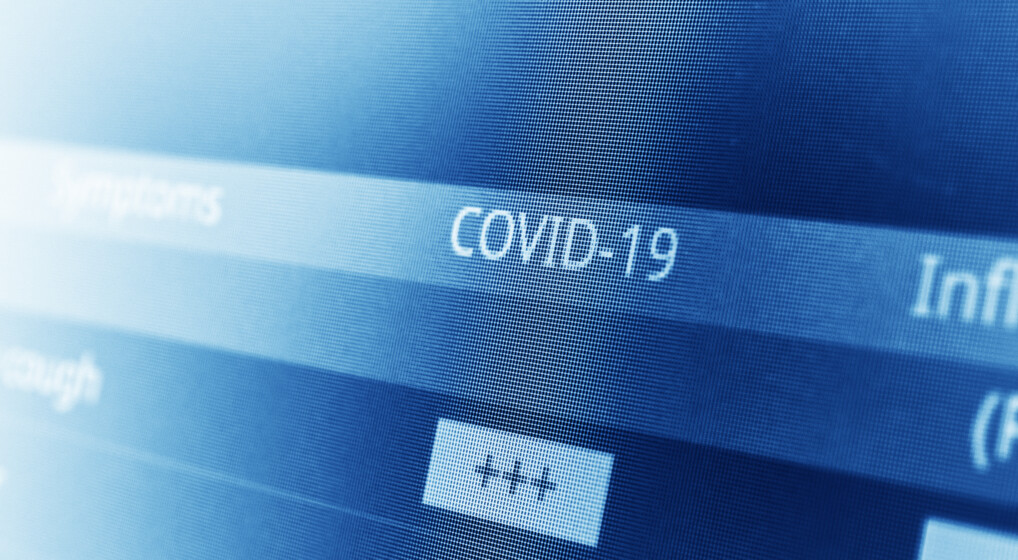 Skærm med teksten COVID-19